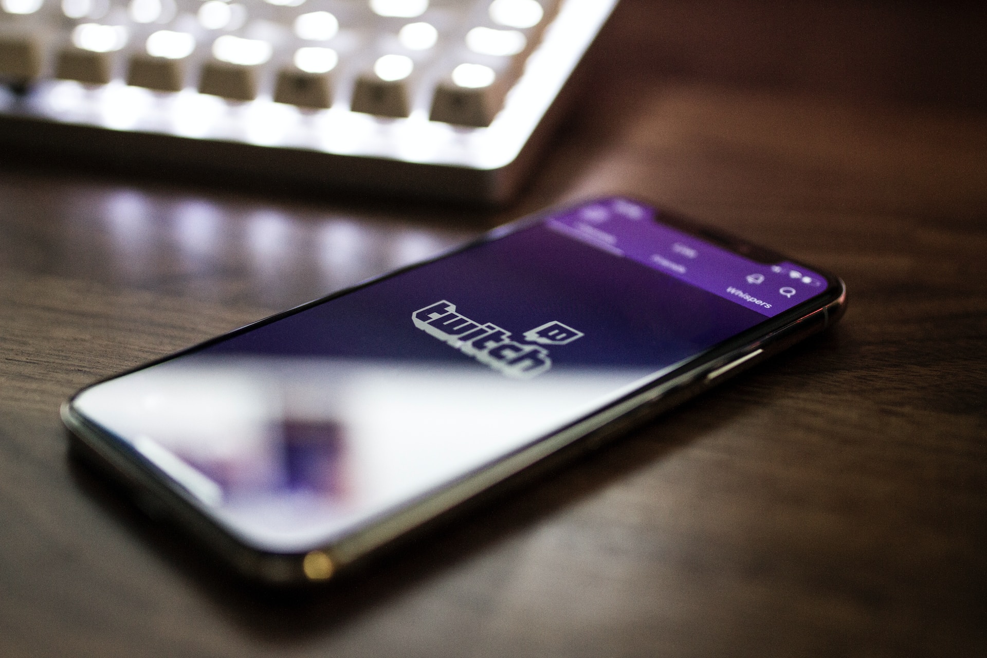 Twitch logo appearing on a mobile phone screen